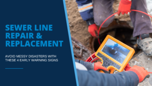Sewer line repair plumber wearing orange gloves and grey coveralls runs a sewer line inspection camera down a pipe while viewing pipe interior on handheld screen
